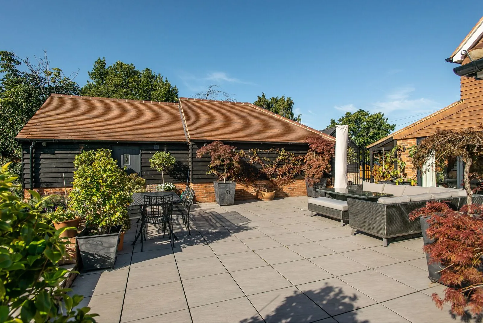 large patio next to barn conversion