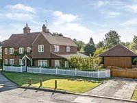 house with white fence